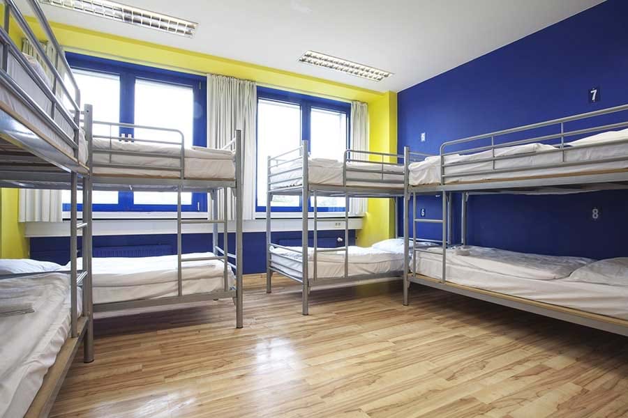 Bed in 8-bed Dorm – Shared Bathrooms